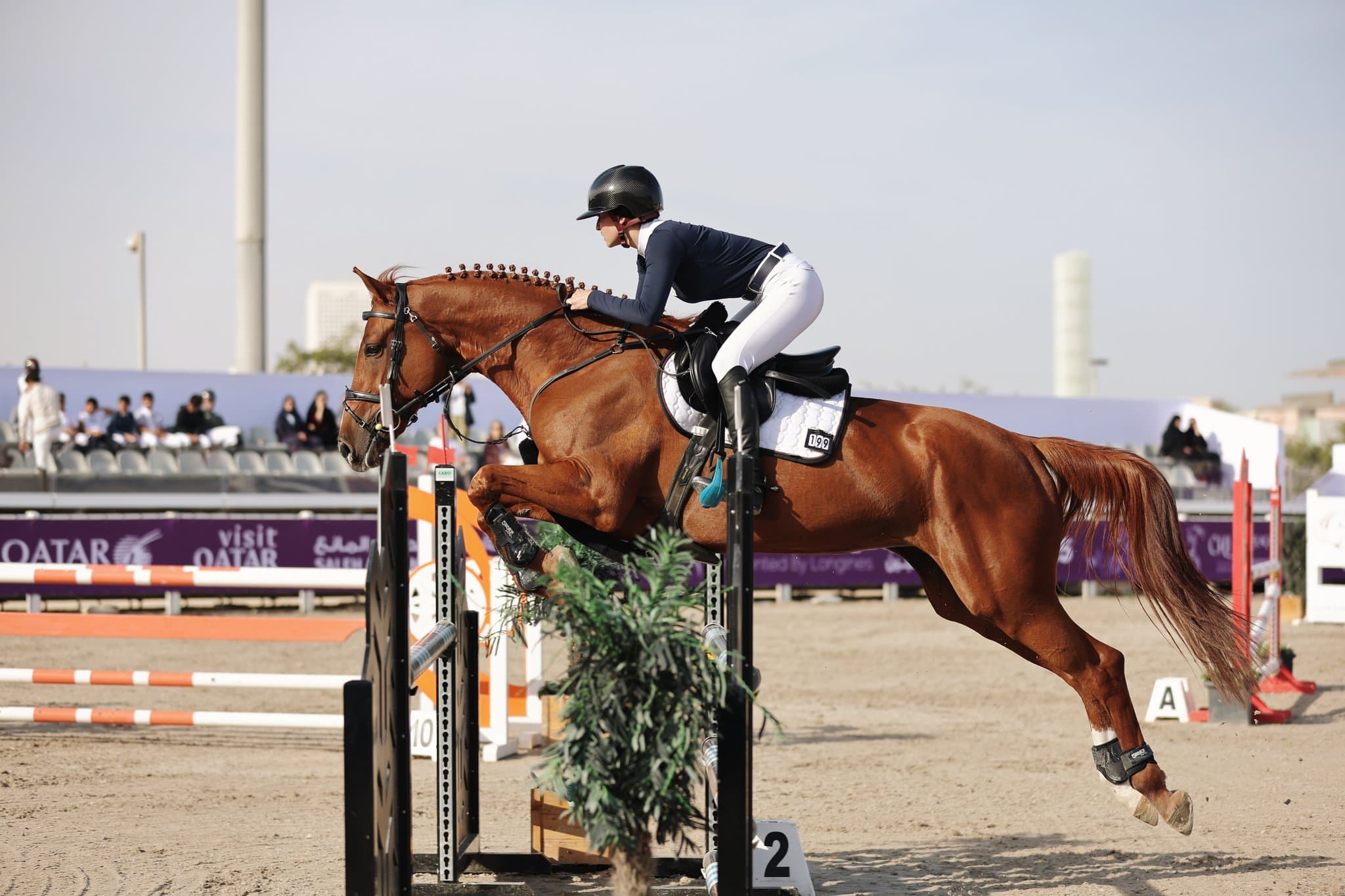 Mona Hammoudi competing in show jumping